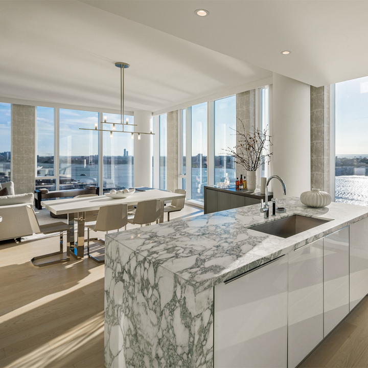 condominium kitchen, living area, and river views